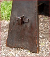 Close-up of keyed-tenon joinery on the front slab leg. 